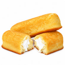 Cargar imagen en el visor de la galería, Dos pastelitos dorados Twinkies sobre fondo blanco, uno completo y otro cortado mostrando relleno.
